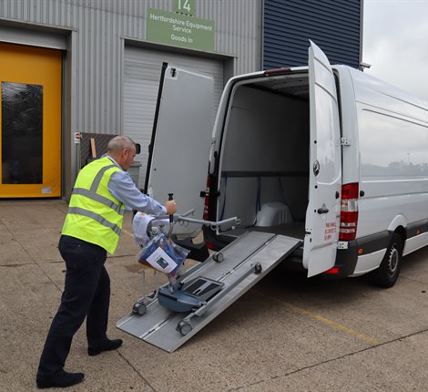 Man loading a van with equipment