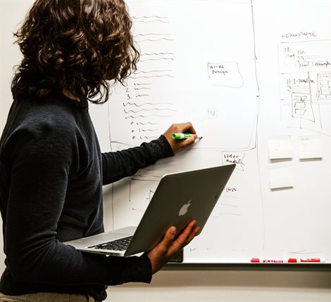 Person planning on a whiteboard
