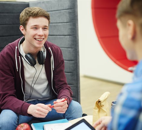 Boy wearing headphones and smiling