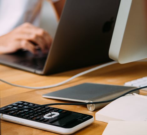 Calculator and a laptop