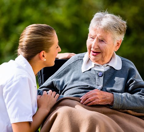 Nurse and older lady in wheelchair