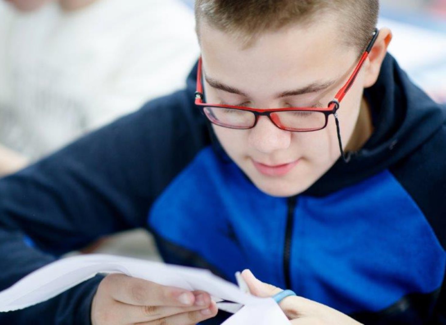Young man using scissors