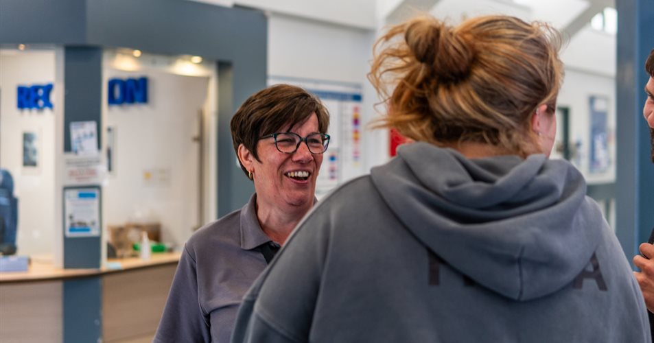 Occupational therapist laughing with clients